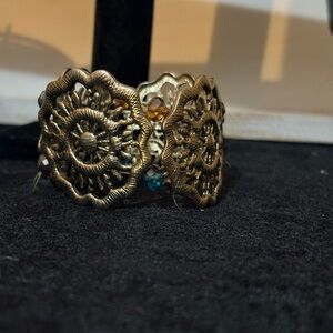 Elegant Gold-Toned Bracelet with Intricate Design